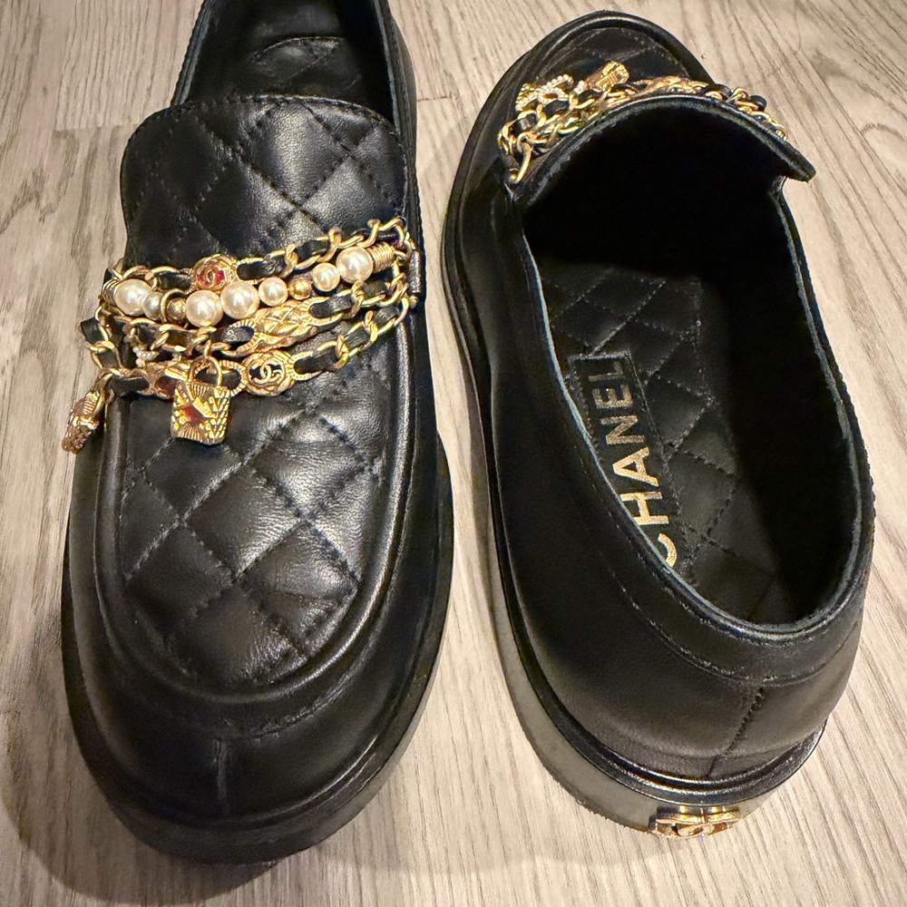 CHANEL Black Quilted Loafers with Gold and Pearl Accents
